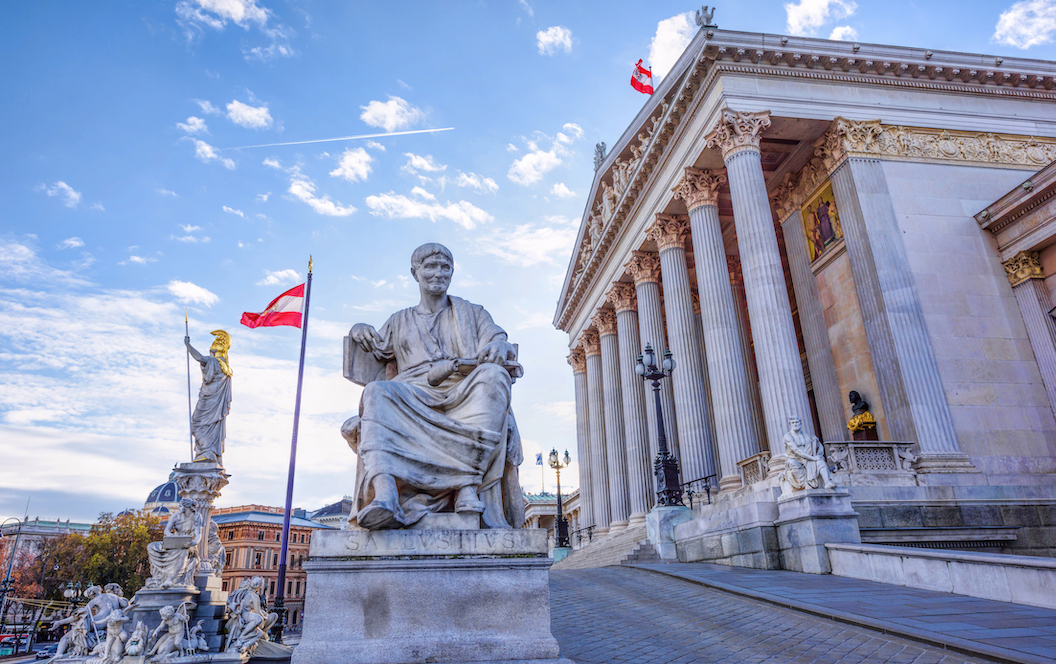 Roman statue at historic building of the austrian parliament in vienna